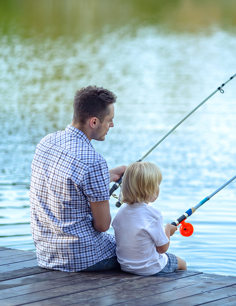 A father fishing with his young child