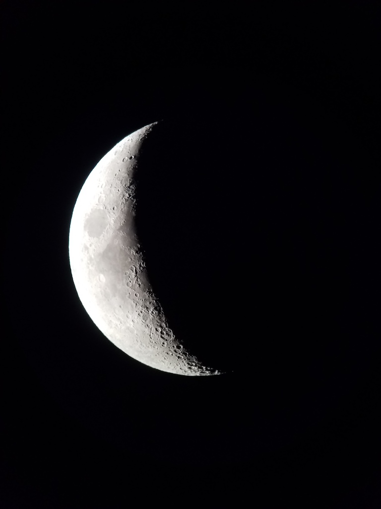 The Moon at night in a quarter phase. 